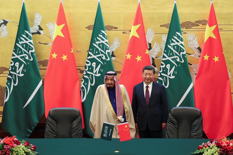 الرئيس الصيني شي جين بينغ والملك السعودي سلمان بن عبد العزيز في بكين في عام 2017/رويترز