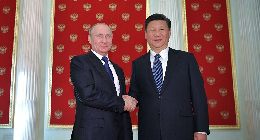 الرئيس الصيني، شي جين بينغ مع الرئيس الروسي فلاديمير بويتين