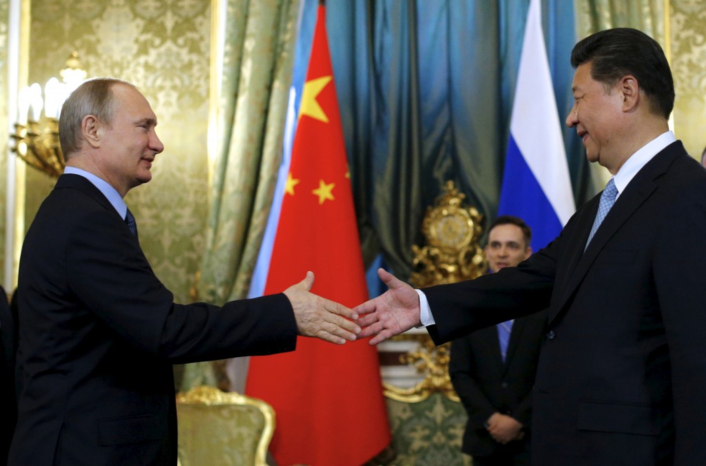 الرئيس الروسي فلاديمير بوتين مع نظيره الصيني شي جين بينغ