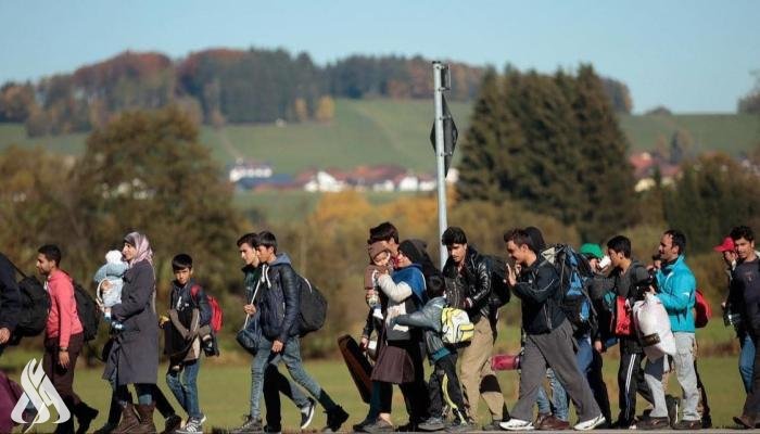 صورة لمهاجرين عراقين على الحدود الألمانية(واع)