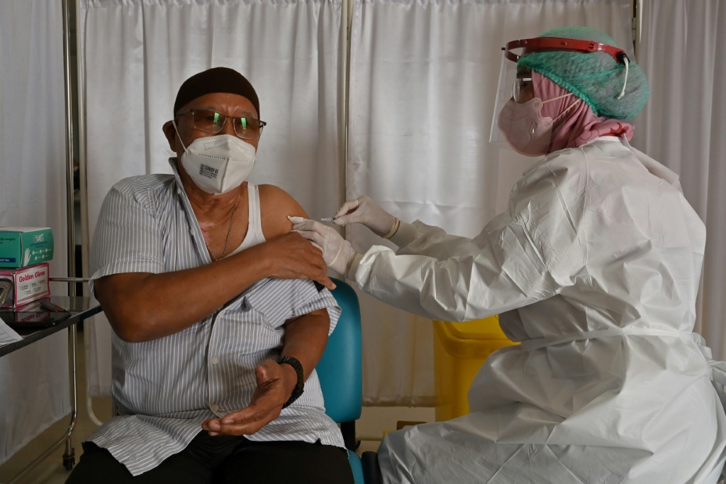 سجلت إندونيسيا 11 ألفا و588 إصابة بفيروس كورونا خلال 24 ساعة (أ ف ب)