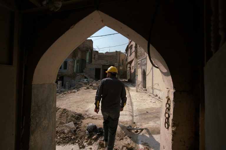 ورشةإعادة بناء منزل في الموصل في شمال العراق في 23 شباط/فبراير 2022 (ا ف ب)