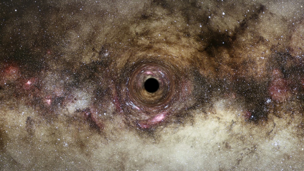 تصوير فني لثقب أسود يحرف مسار ضوء يمر بجانبه، نشرته وكالة الفضاء الأوروبية بتاريخ العاشر من حزيران/يونيو 2022 (ا ف ب)
