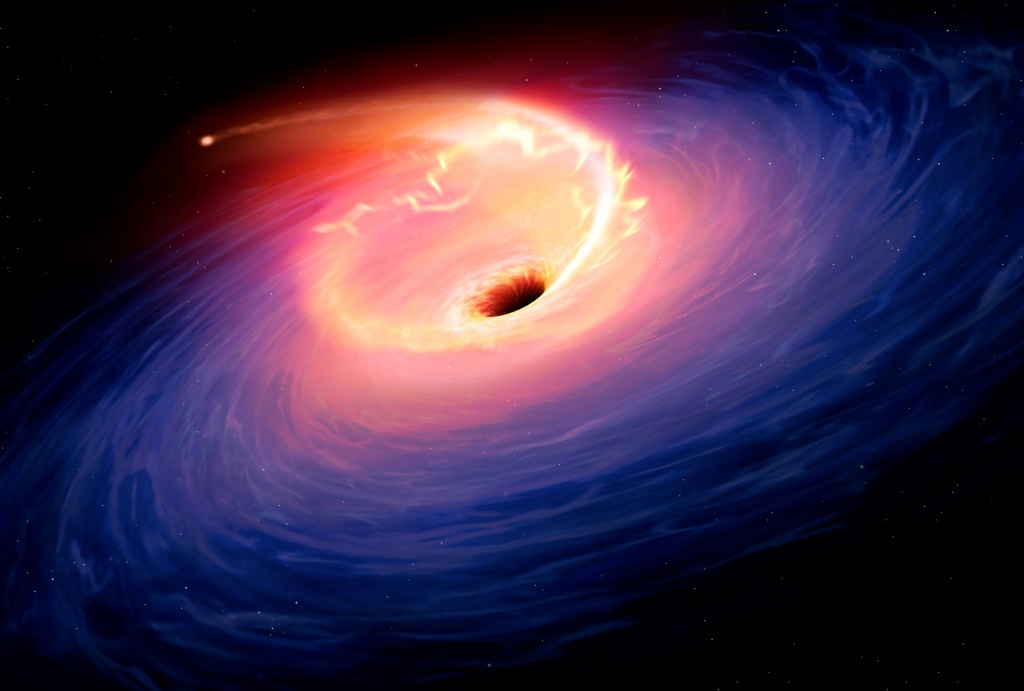 تصوير فنّي لنجم يمزقه ثقب أسود (ا ف ب)