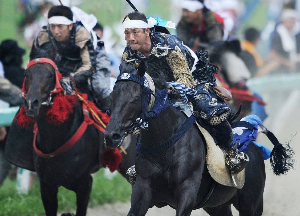 جانب من مهرجان سوما نوماوي الياباني (ا ف ب)