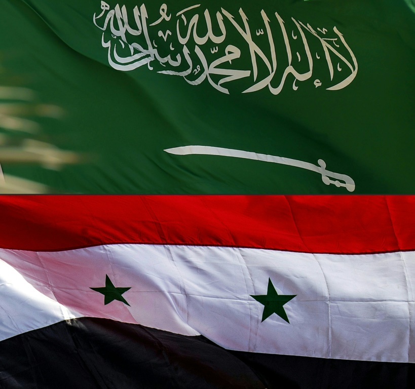 صورة مركبة في 23 آيار/مارس 2023 تظهر العلمين السعودي والسوري (أ ف ب)    0