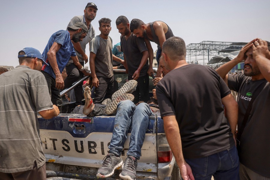 الفلسطينيون يواجهون القتل اليومي في غزة من قبل الديش الاسرائيلي (أ ف ب)