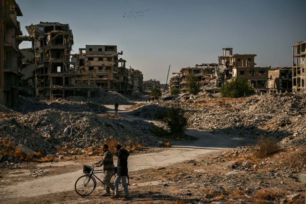 مبان مدمرة ومتضررة في مخيم اليرموك جنوب دمشق في كانون الاول/ديسمبر 2024 (ا ف ب)