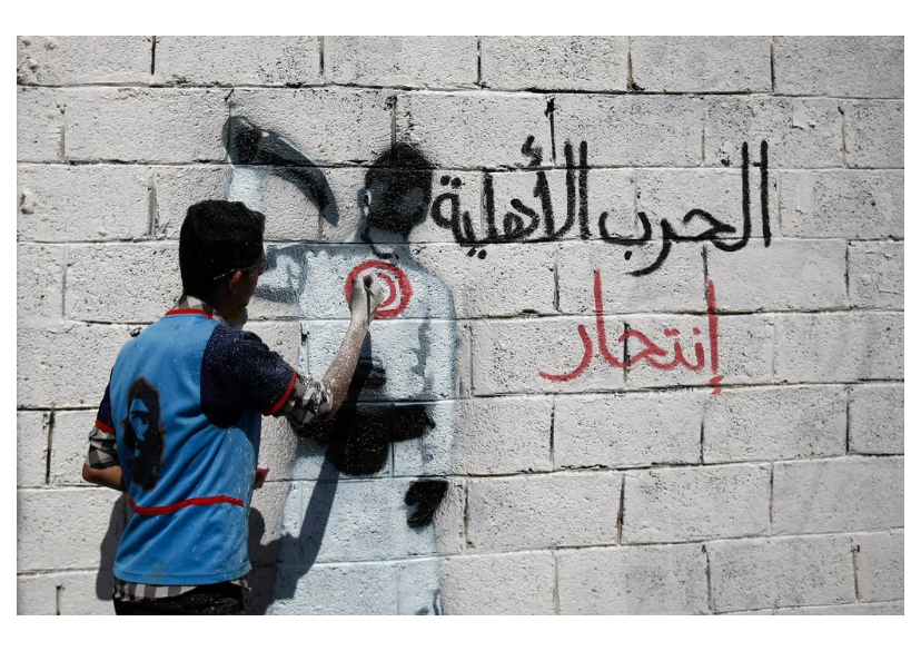 *الصورة المرفقة لناشط يمني يُحذر مواطنيه من خطر الحرب الأهلية في رسم يخطه على أحد الجدران في العاصمة صنعاء يوم 9 يناير 2014 ، فلم يسمعه أحد (مواقع تواصل)